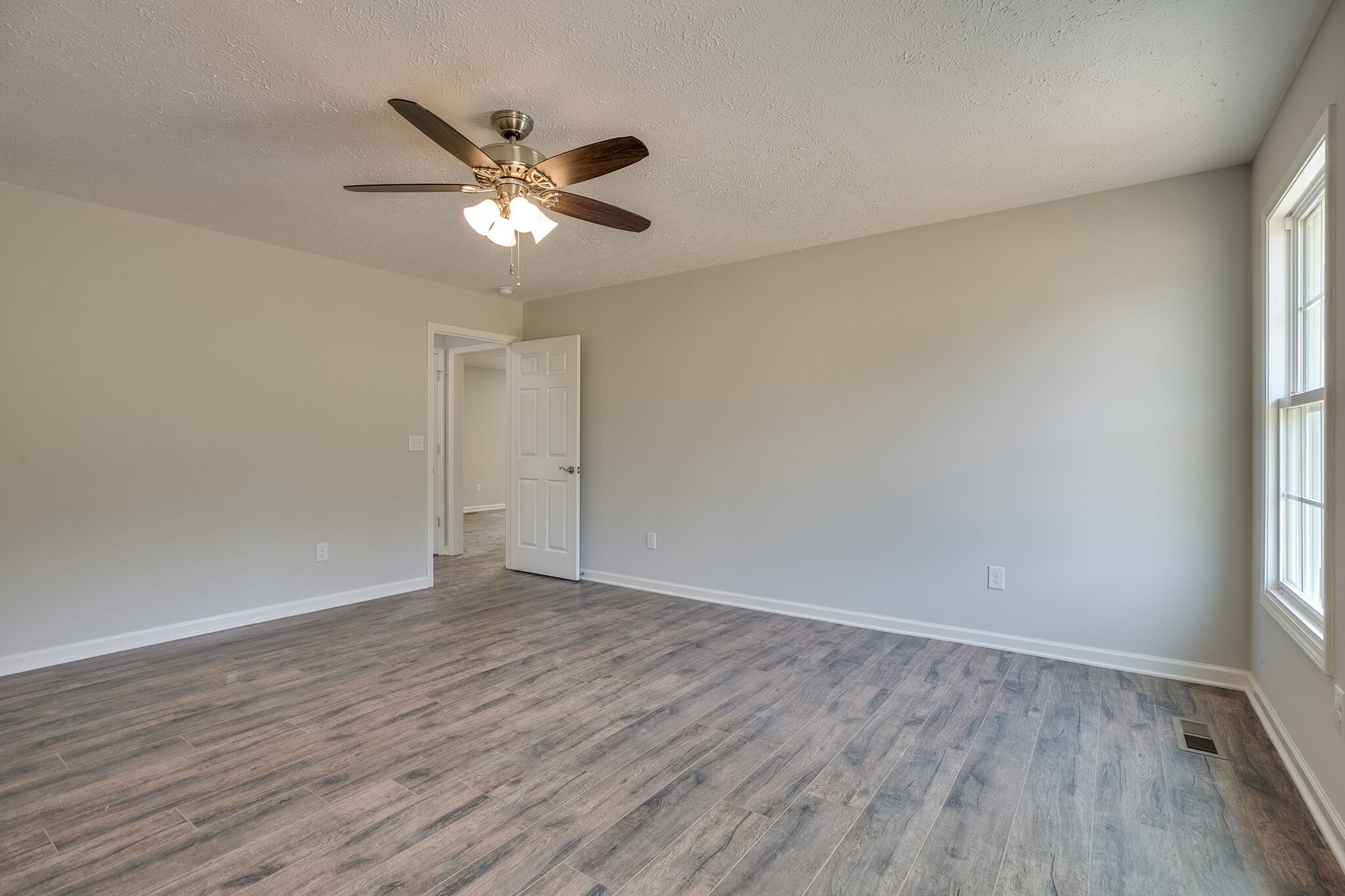 713 Jarrell Road Manchester, TN 37355 - Photo 17 of 25 wooden floor in an empty room with a window