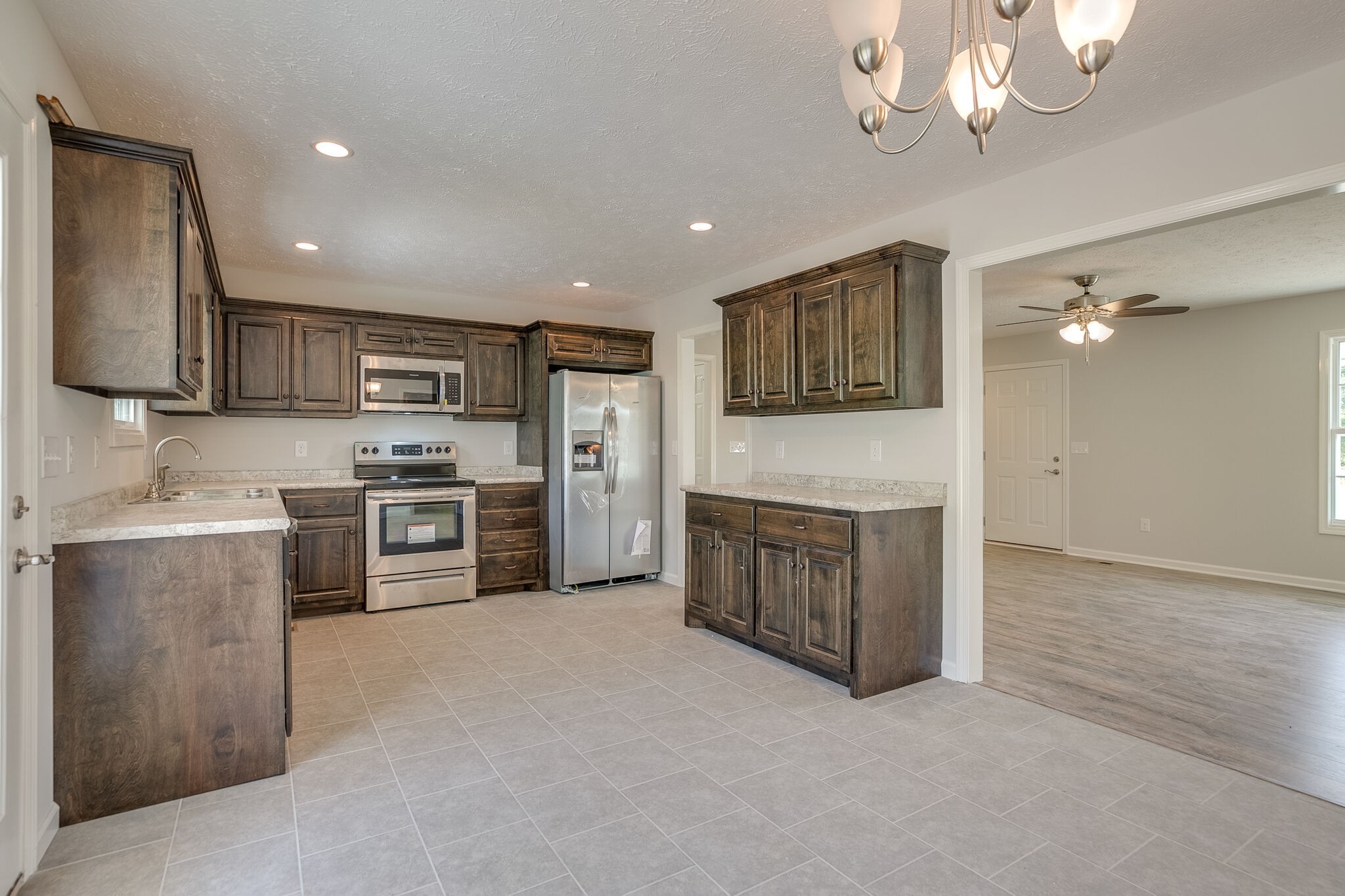 713 Jarrell Road Manchester, TN 37355 - Photo 7 of 25 a kitchen with stainless steel appliances a refrigerator sink and stove