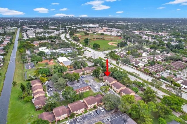 an aerial view of city and lake