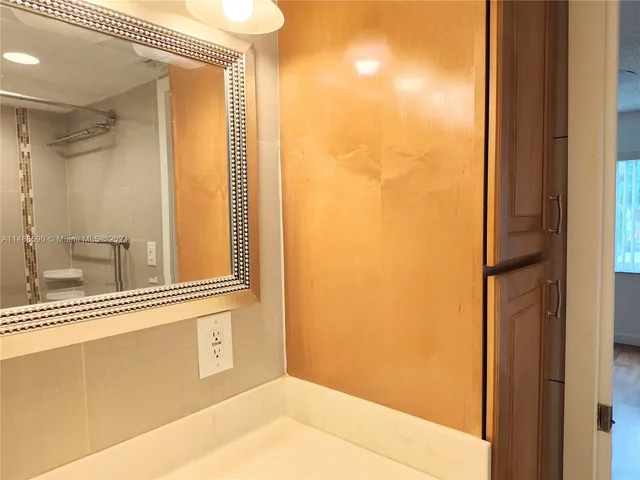 a view of a bathroom from a glass door