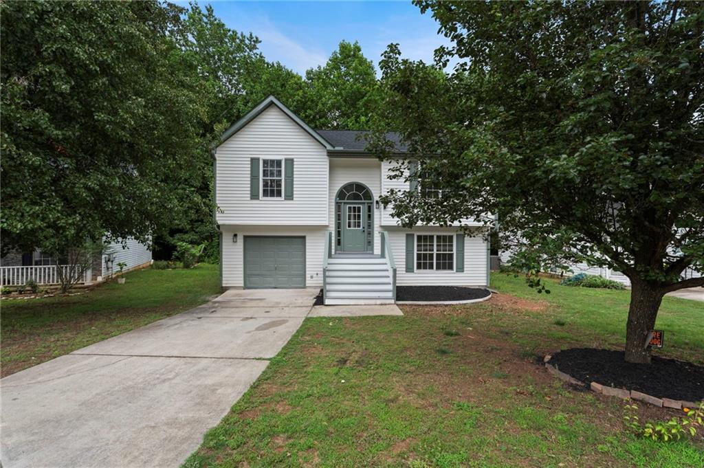 3602 Bristol Overlook Rex, GA 30273 - Photo 3 of 37 a front view of a house with a yard and garage
