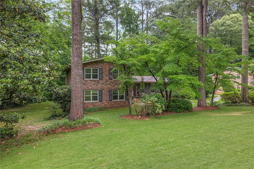 1911 Alderbrook Road Northeast Atlanta, GA 30345 - Photo 2 of 33 a view of backyard of house with green space
