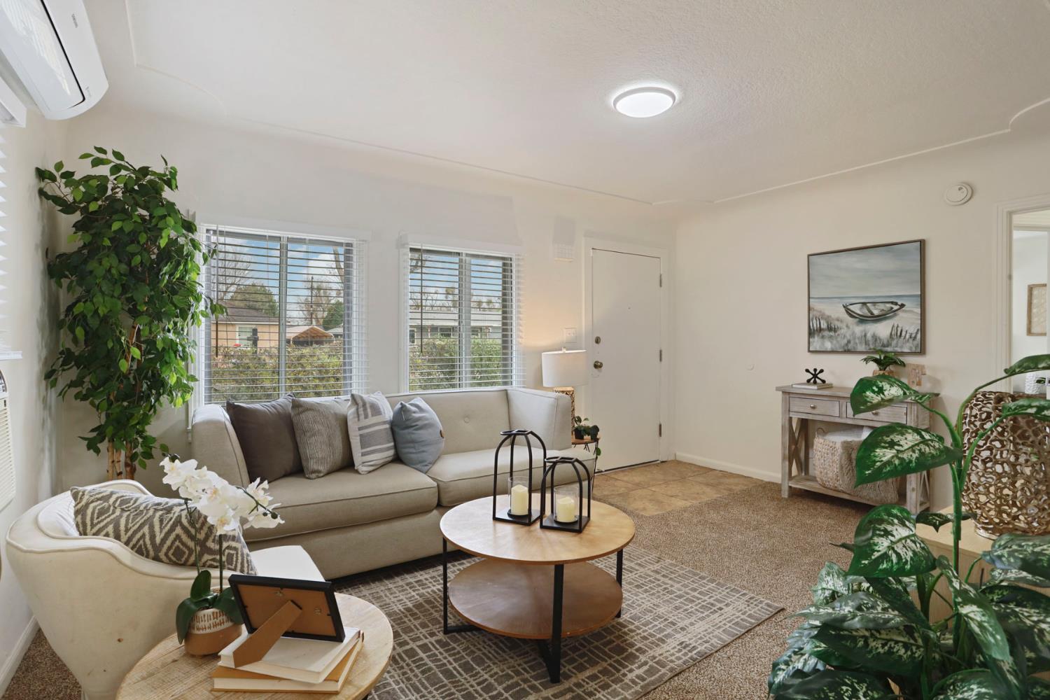 1436 Teresa Street Modesto, CA 95350 - Photo 11 of 32 a living room with furniture and a large window