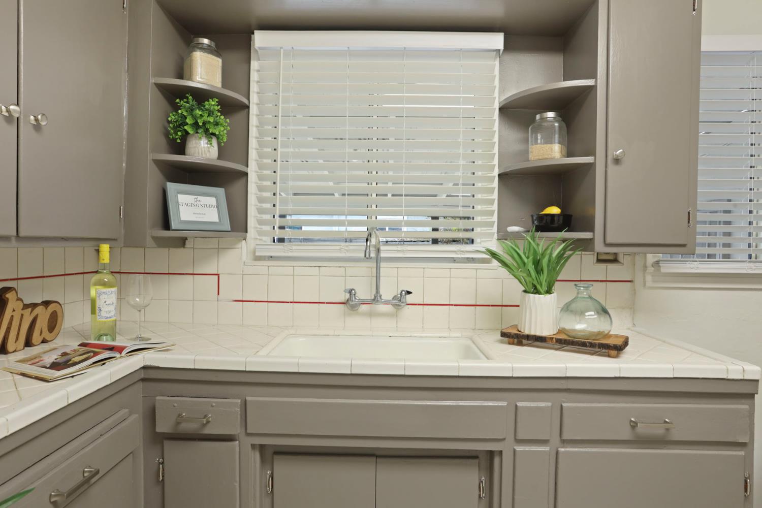 1436 Teresa Street Modesto, CA 95350 - Photo 15 of 32 a kitchen with a sink and a potted plant