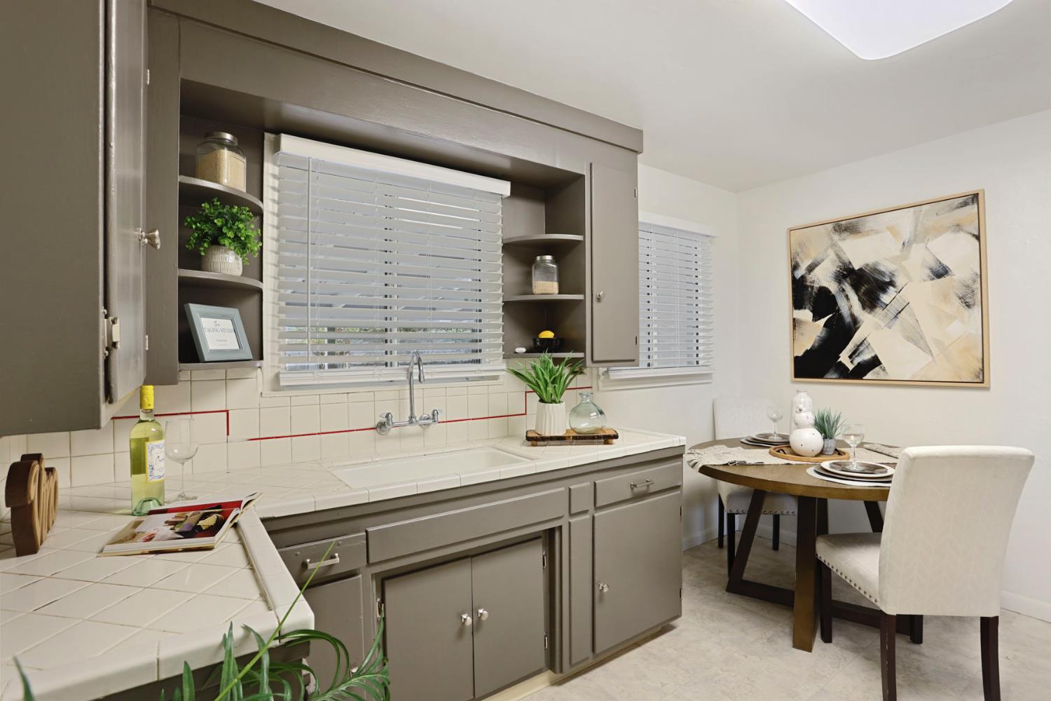 1436 Teresa Street Modesto, CA 95350 - Photo 16 of 32 a kitchen with a sink stove and cabinets
