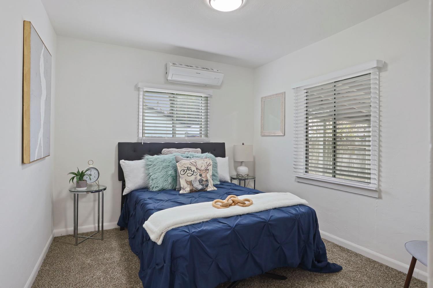 1436 Teresa Street Modesto, CA 95350 - Photo 21 of 32 a bedroom with a bed and a window