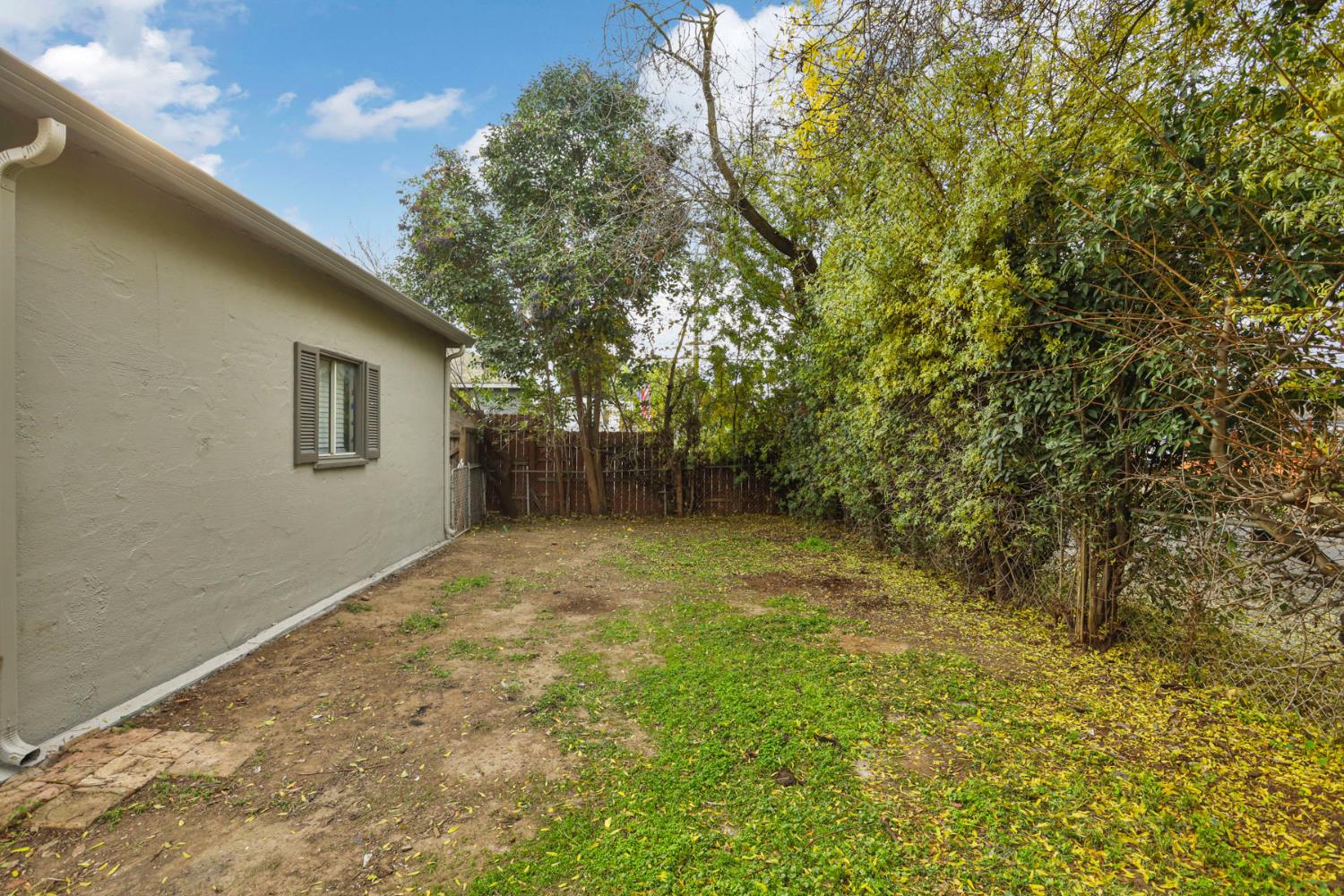 1436 Teresa Street Modesto, CA 95350 - Photo 32 of 32 a backyard of a house with lots of green space