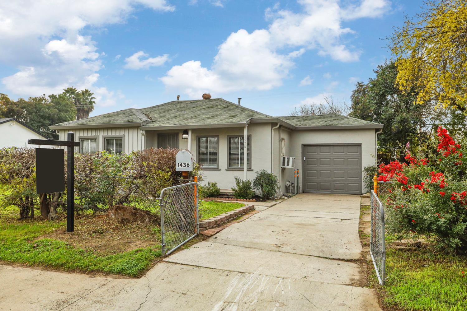 1436 Teresa Street Modesto, CA 95350 - Photo 5 of 32 a front view of a house with garden