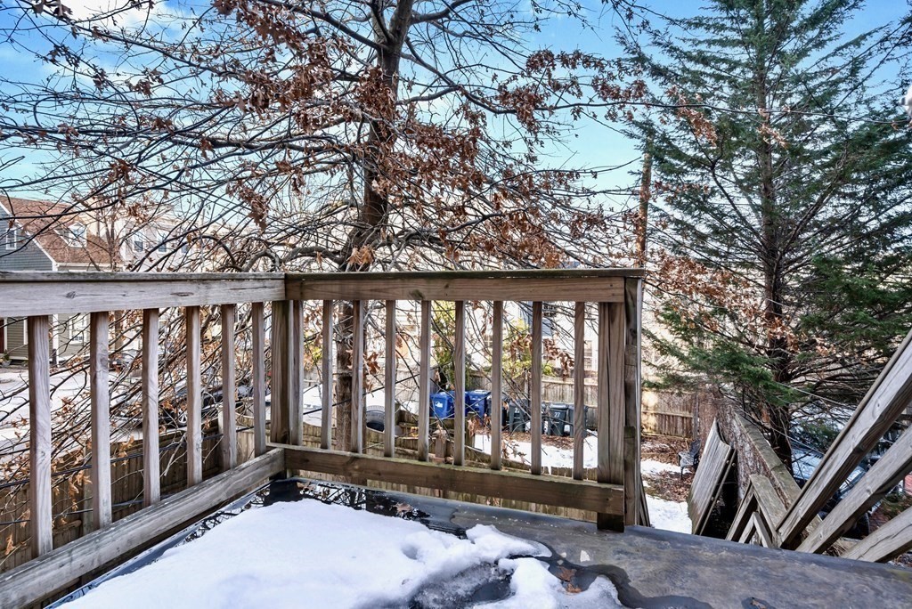 27 Monument Square, Unit 2 Boston, MA 02129 - Photo 10 of 17 a view of a balcony with wooden floor and fence
