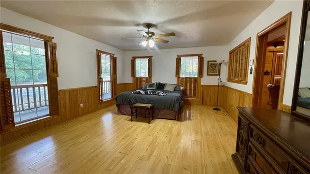 a view of a room with wooden floor