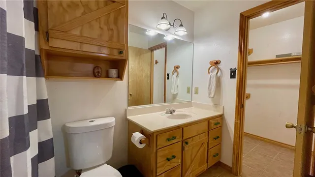 a view of a room with wooden floors and a window