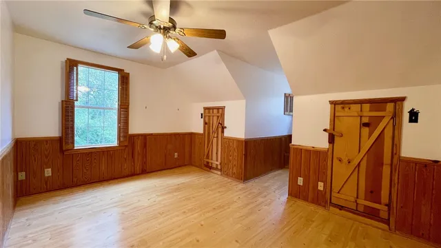 a bathroom with a sink a toilet a mirror and shower