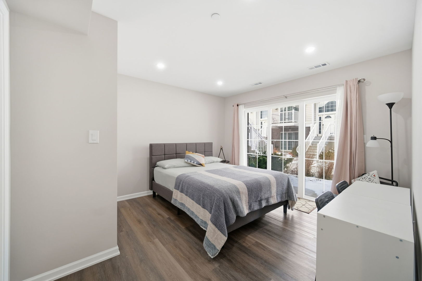 7214 Farmstead Lane Hanover Park, IL 60133 - Photo 15 of 30 a bedroom with a bed and large window