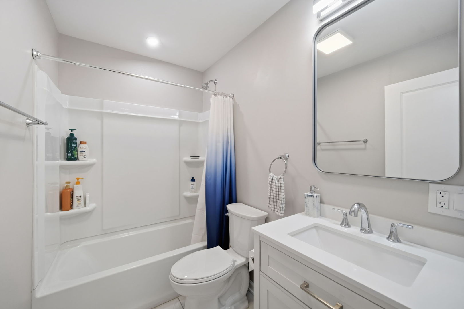 7214 Farmstead Lane Hanover Park, IL 60133 - Photo 19 of 30 a bathroom with a sink a toilet and shower