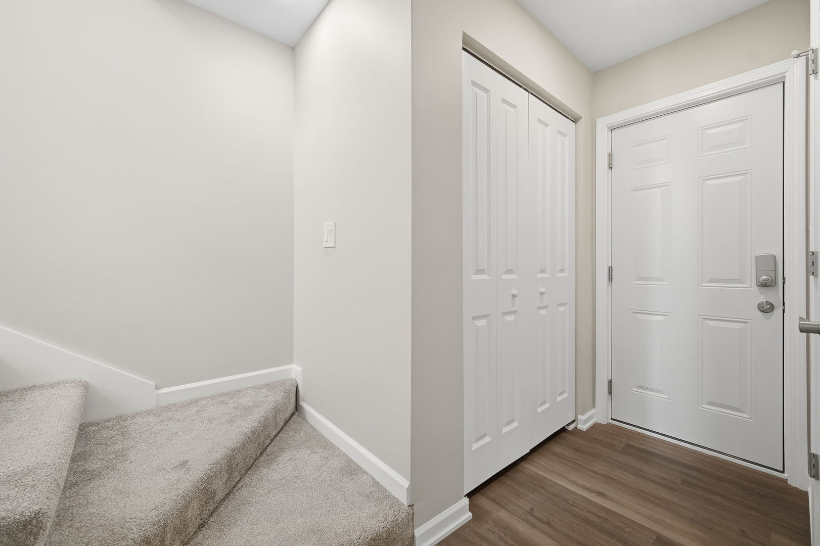 7214 Farmstead Lane Hanover Park, IL 60133 - Photo 24 of 30 a view of hallway with closet and wooden floor
