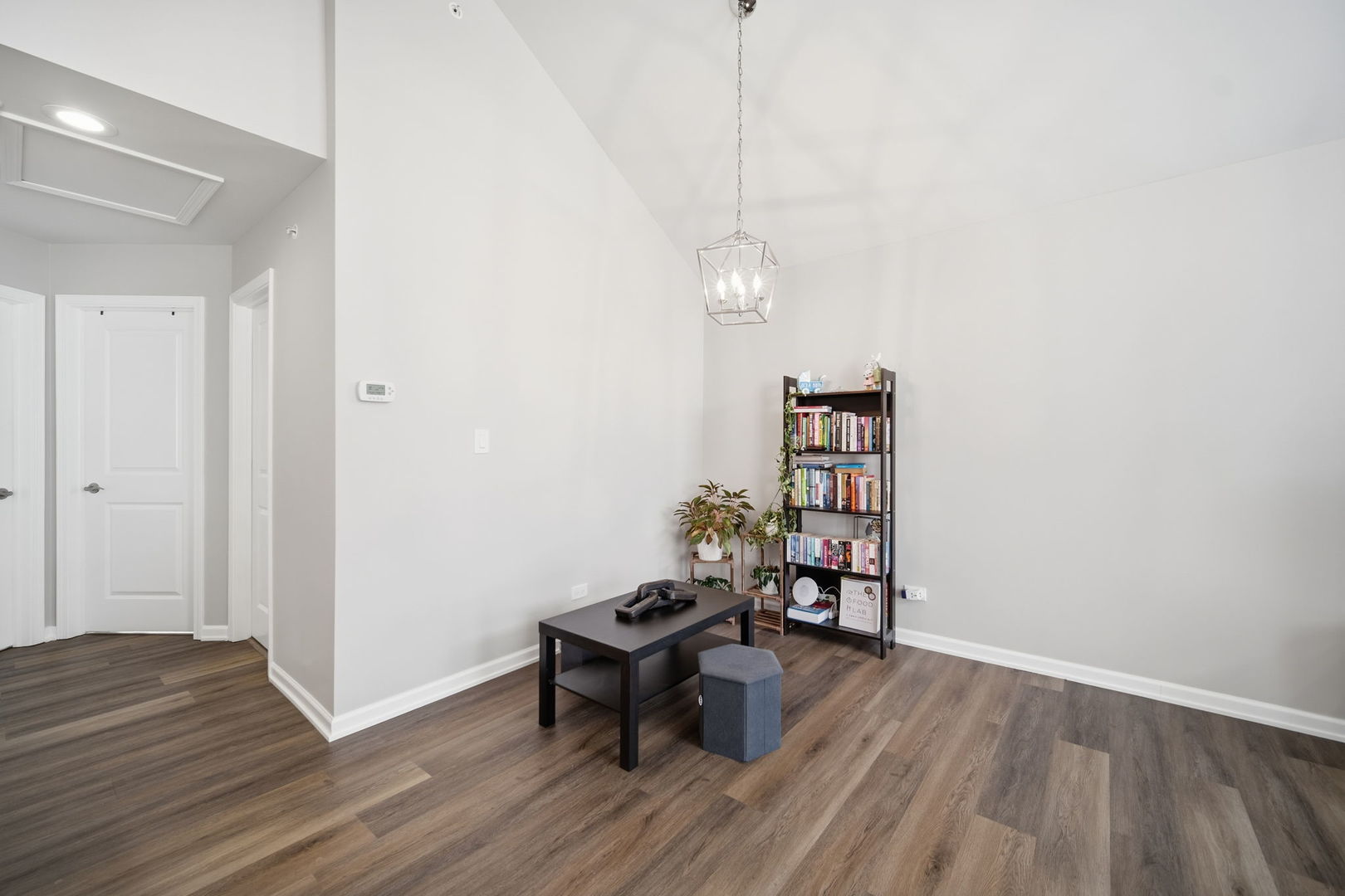 7214 Farmstead Lane Hanover Park, IL 60133 - Photo 7 of 30 a view of a room with wooden floor and furniture