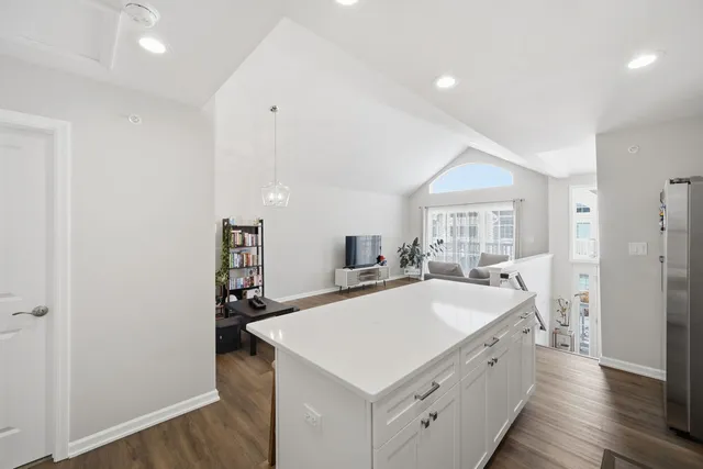a kitchen with a sink a stove and a refrigerator