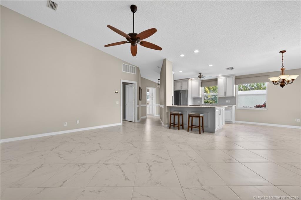 1687 Southwest Springfield Court Palm City, FL 34990 - Photo 11 of 34 Quartz counter-tops and large eating bar