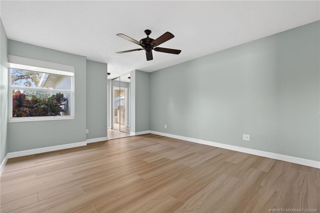 1687 Southwest Springfield Court Palm City, FL 34990 - Photo 20 of 34 Main bath features dual vanities, large walk-in shower and linen closet.