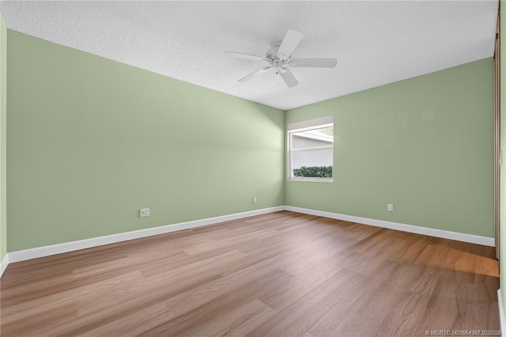 1687 Southwest Springfield Court Palm City, FL 34990 - Photo 24 of 34 Guest Bedroom features large walk-in closet