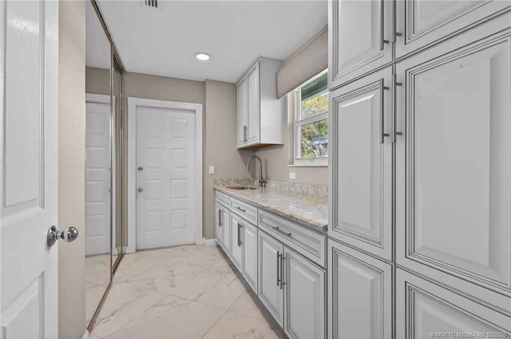 1687 Southwest Springfield Court Palm City, FL 34990 - Photo 28 of 34 Laundry room - washer/dryer 2025