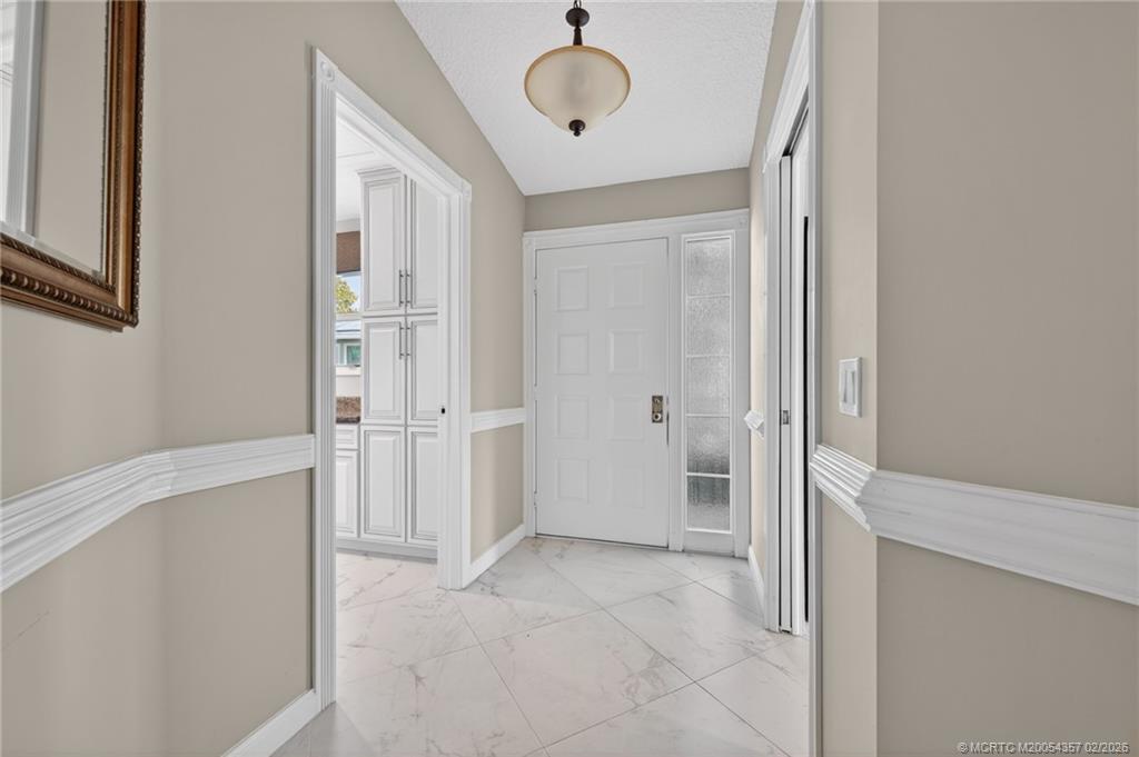 1687 Southwest Springfield Court Palm City, FL 34990 - Photo 6 of 34 Open, light & bright. Impact windows through-out.