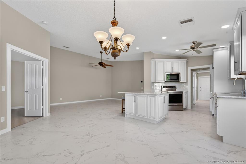 1687 Southwest Springfield Court Palm City, FL 34990 - Photo 8 of 34 A/C - 2025