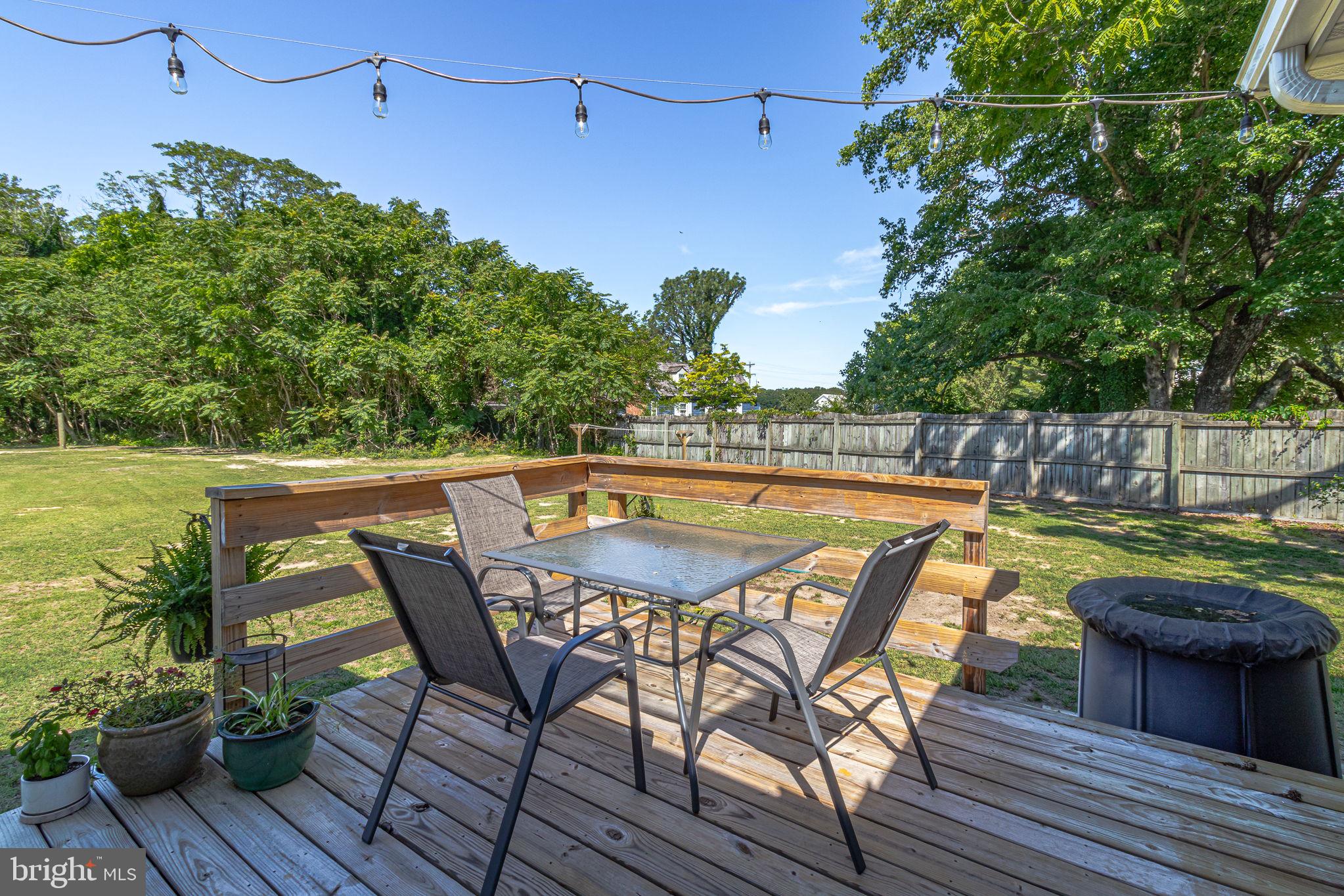 9832 River Road Lancaster, VA 22503 - Photo 54 of 68 Serene deck with lush green views.