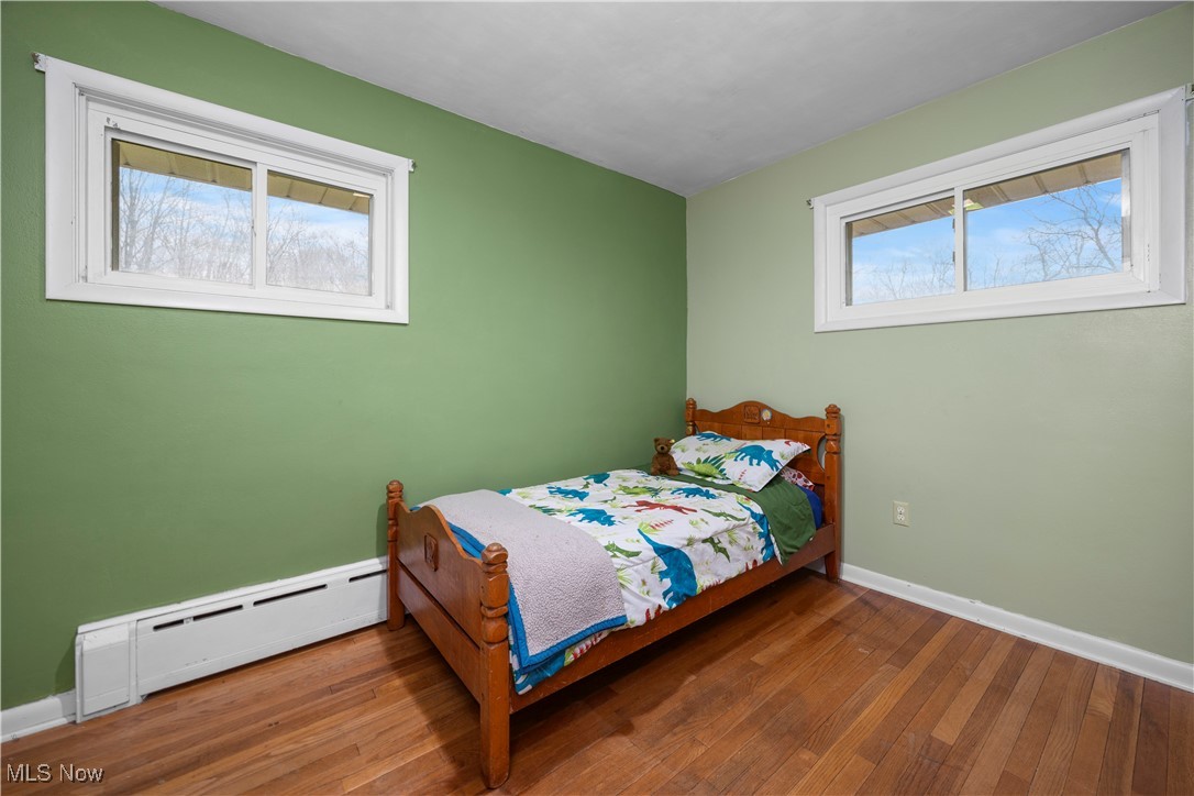 14312 Butler Road Wakeman, OH 44889 - Photo 24 of 42 bedroom with hardwood floors and built in desk area