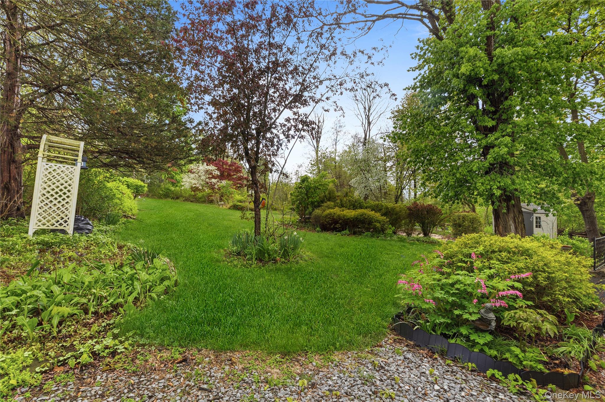25 West Branch Road Mahopac, NY 10541 - Photo 19 of 21 a view of a backyard with large trees