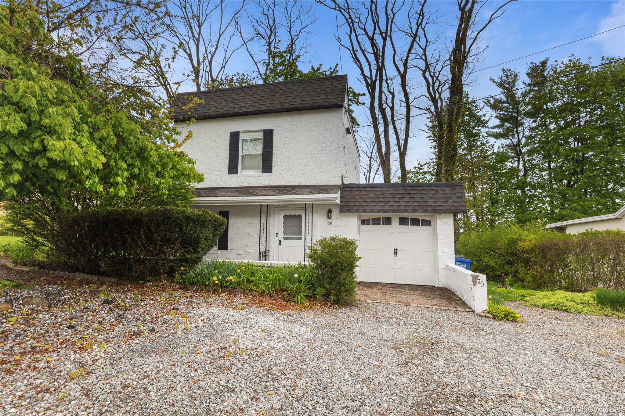 25 West Branch Road Mahopac, NY 10541 - Photo 2 of 21 a front view of a house with a yard and garage