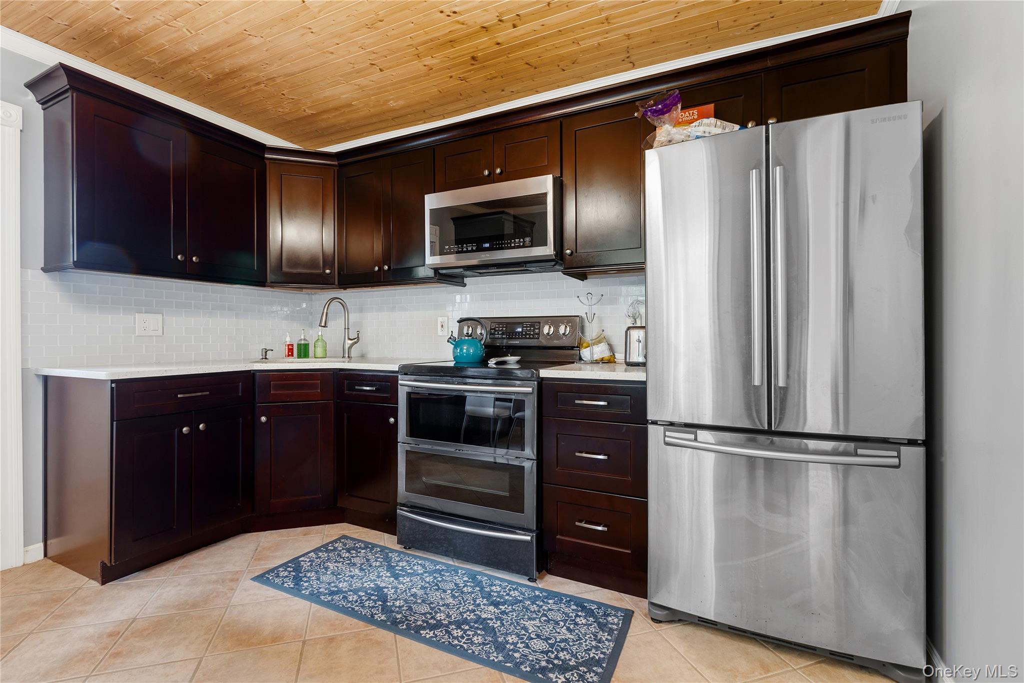 25 West Branch Road Mahopac, NY 10541 - Photo 6 of 21 a kitchen with stainless steel appliances granite countertop a refrigerator and a microwave