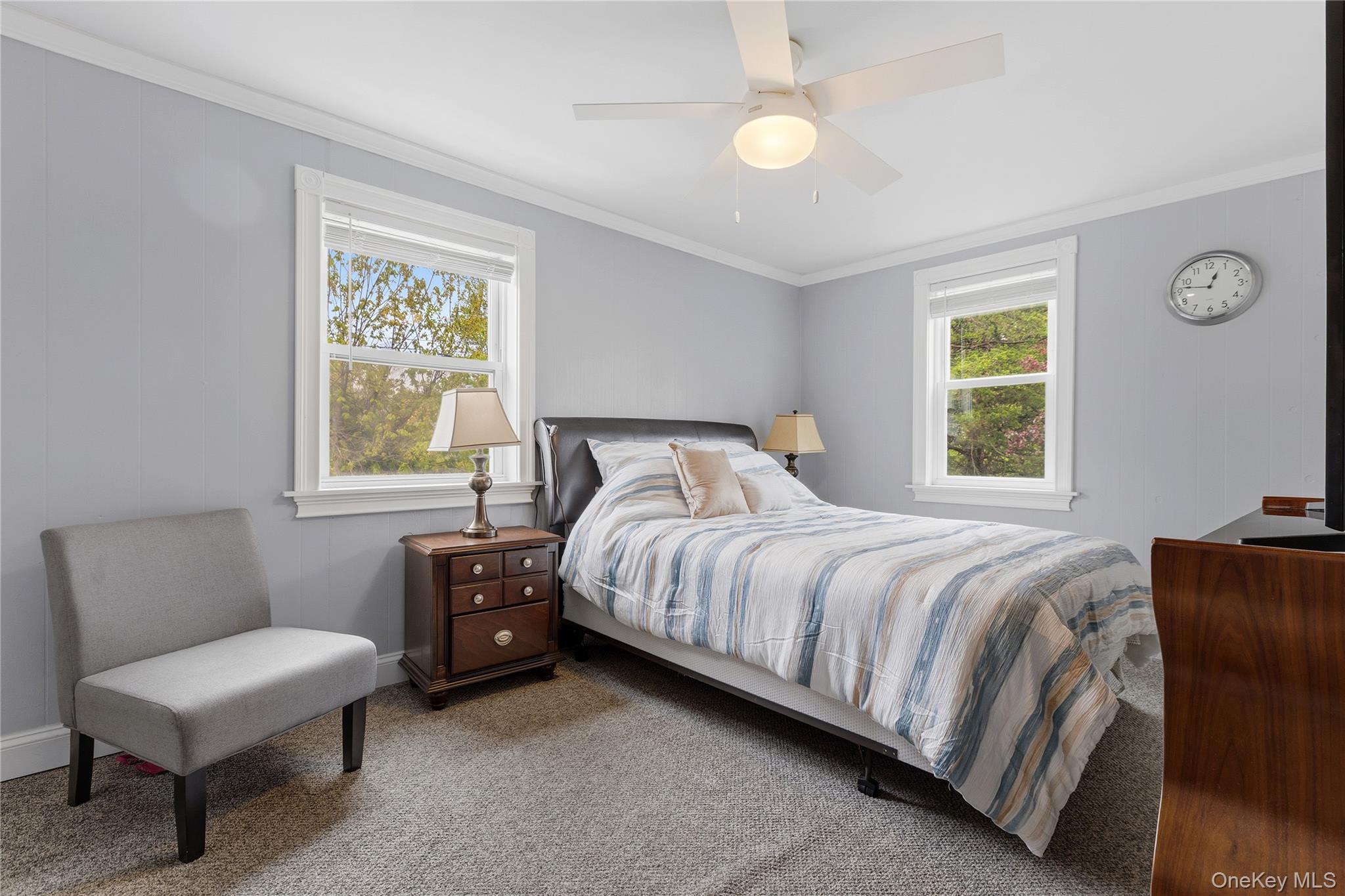 25 West Branch Road Mahopac, NY 10541 - Photo 10 of 21 a bedroom with a bed a couch and a window