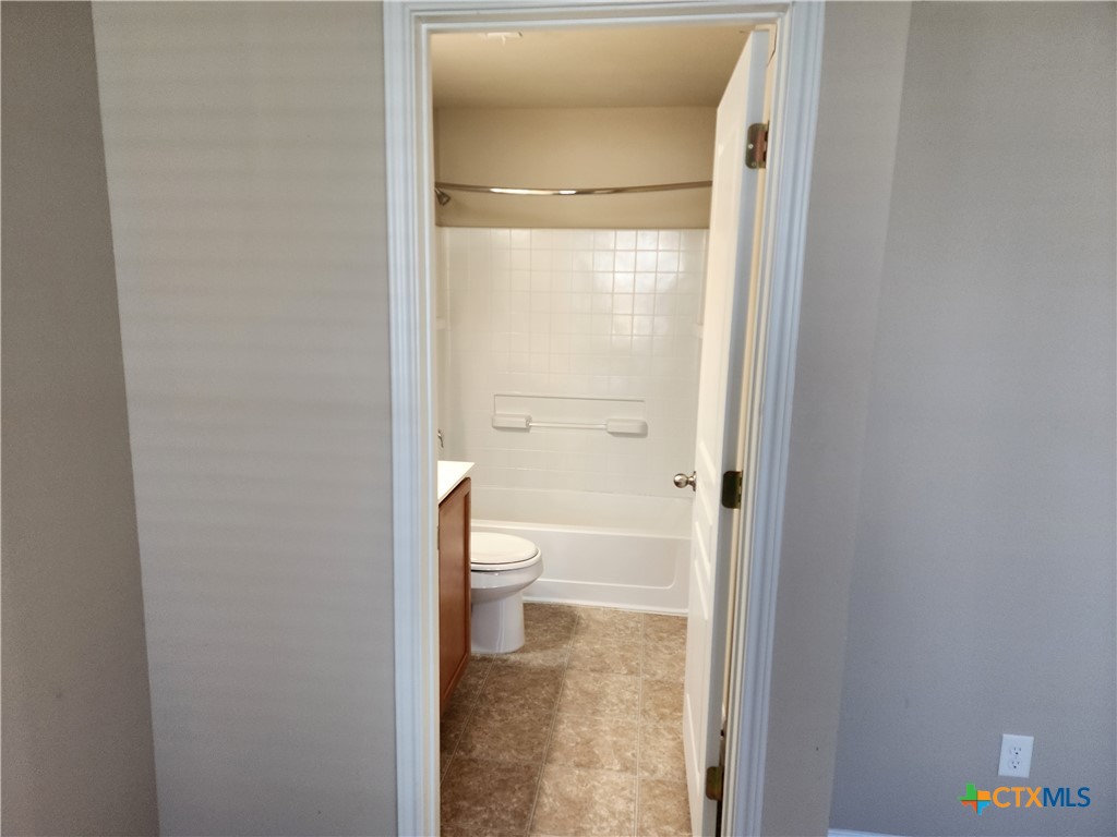 330 Trestle Tree, Unit 22 San Marcos, TX 78666 - Photo 22 of 33 a bathroom with a toilet and a shower