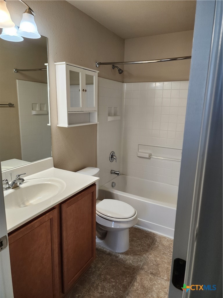 330 Trestle Tree, Unit 22 San Marcos, TX 78666 - Photo 23 of 33 a bathroom with a sink toilet and shower