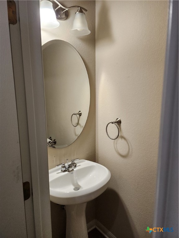 330 Trestle Tree, Unit 22 San Marcos, TX 78666 - Photo 10 of 33 a bathroom with a sink and mirror
