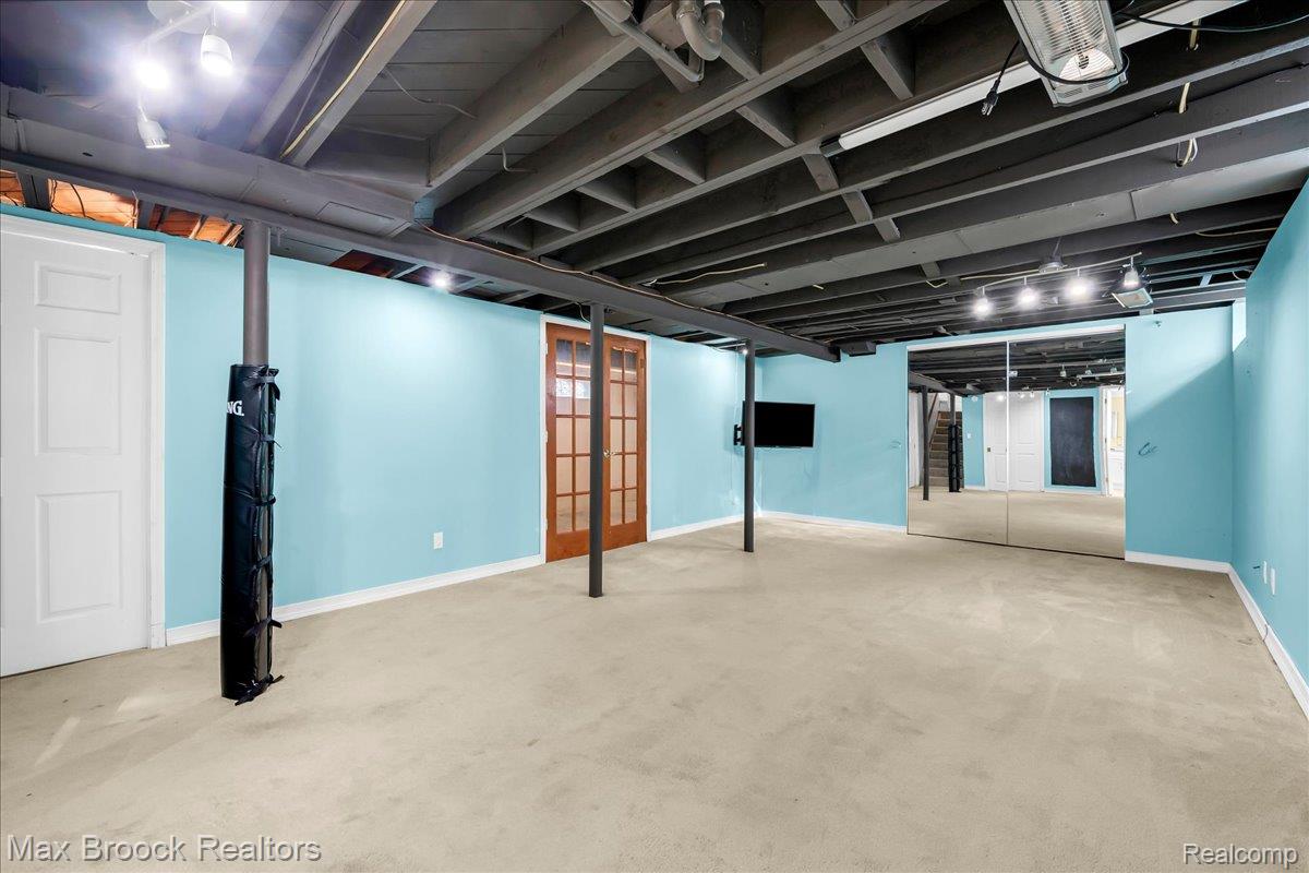 1311 Harvard Road Berkley, MI 48072 - Photo 22 of 29 Finished basement with light colored carpet and baseboards