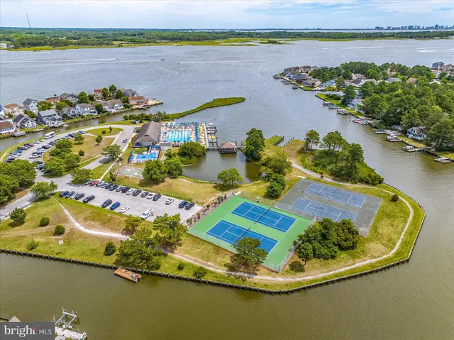 an aerial view of a house with a lake view