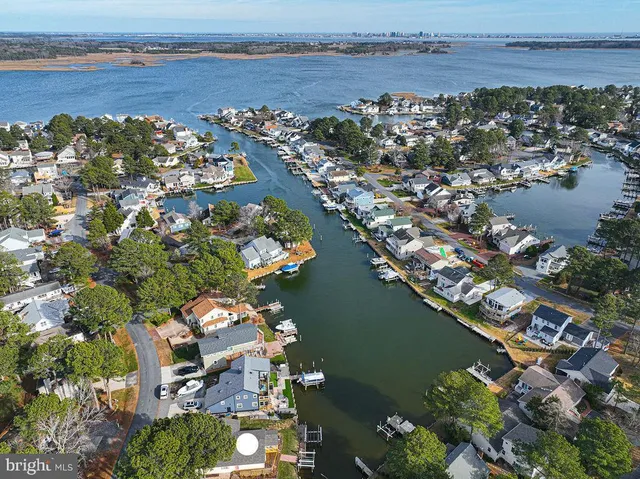 an aerial view of a house with a lake view
