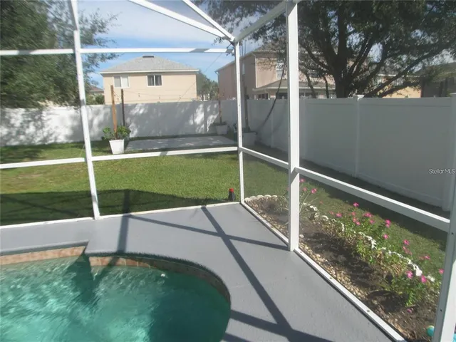 a white bench sitting in front of a building