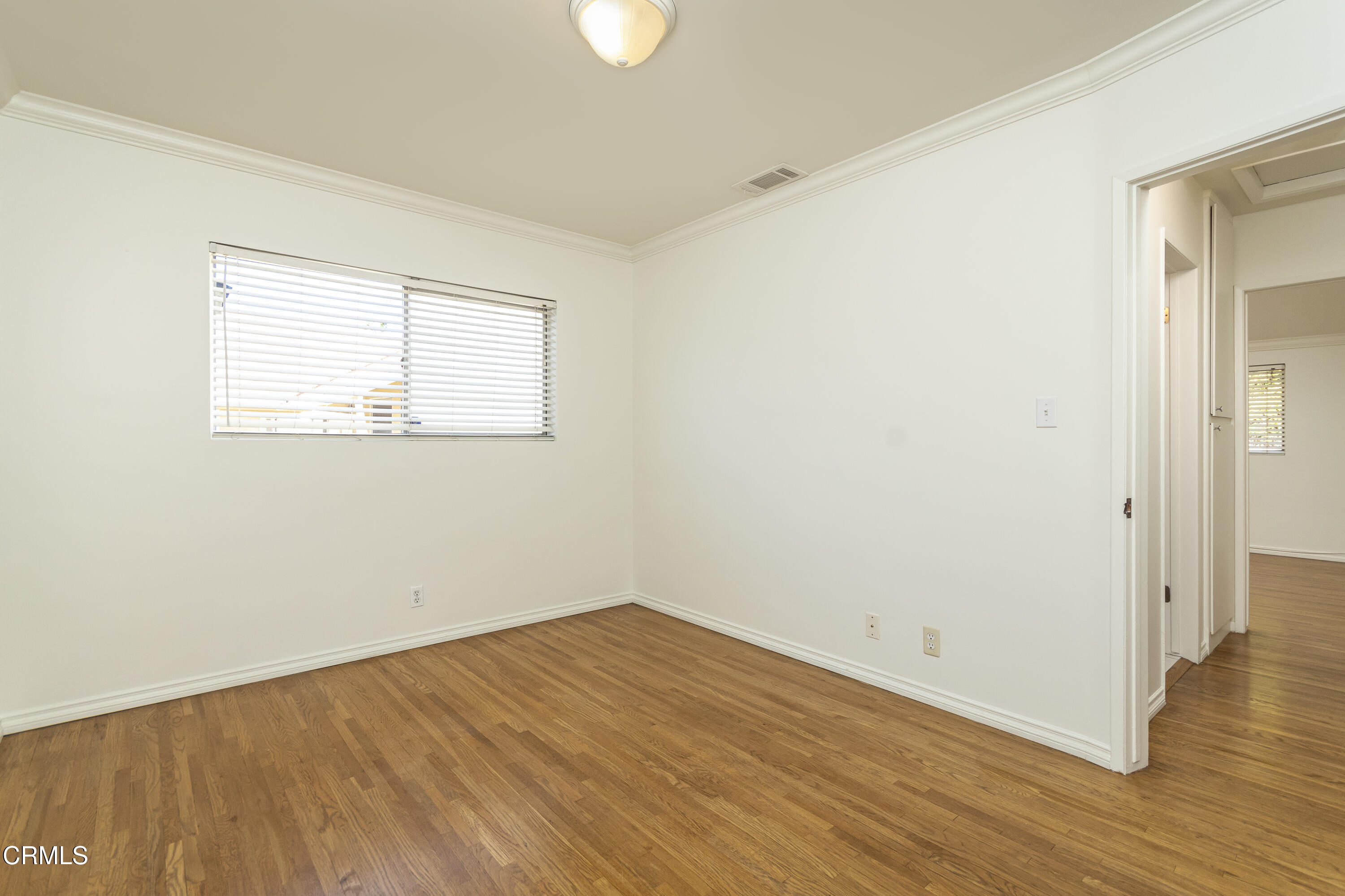 3021 Ashwin Drive, Unit B La Crescenta, CA 91214 - Photo 13 of 20 an empty room with wooden floor and windows