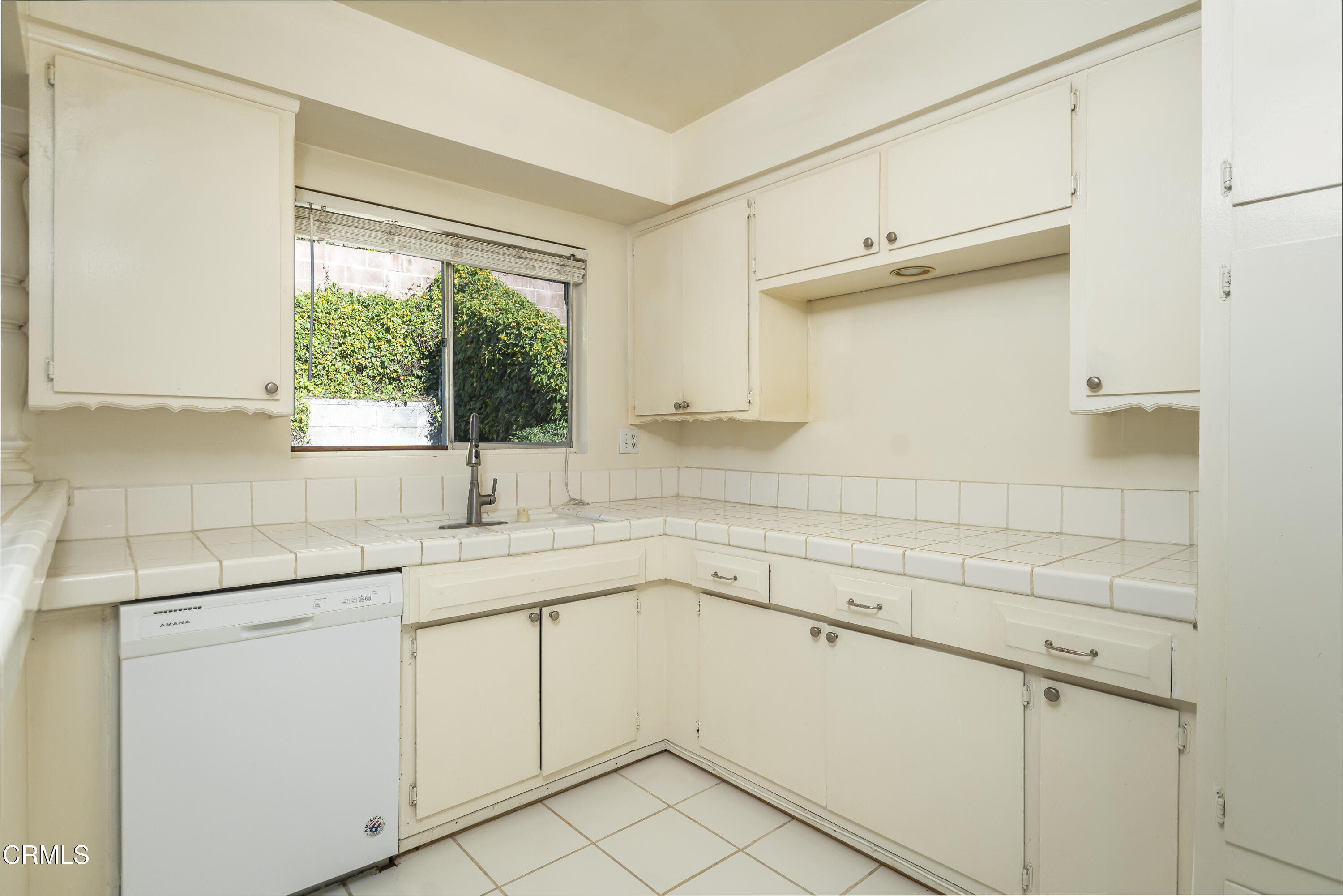 3021 Ashwin Drive, Unit B La Crescenta, CA 91214 - Photo 8 of 20 a kitchen with a sink cabinets and window