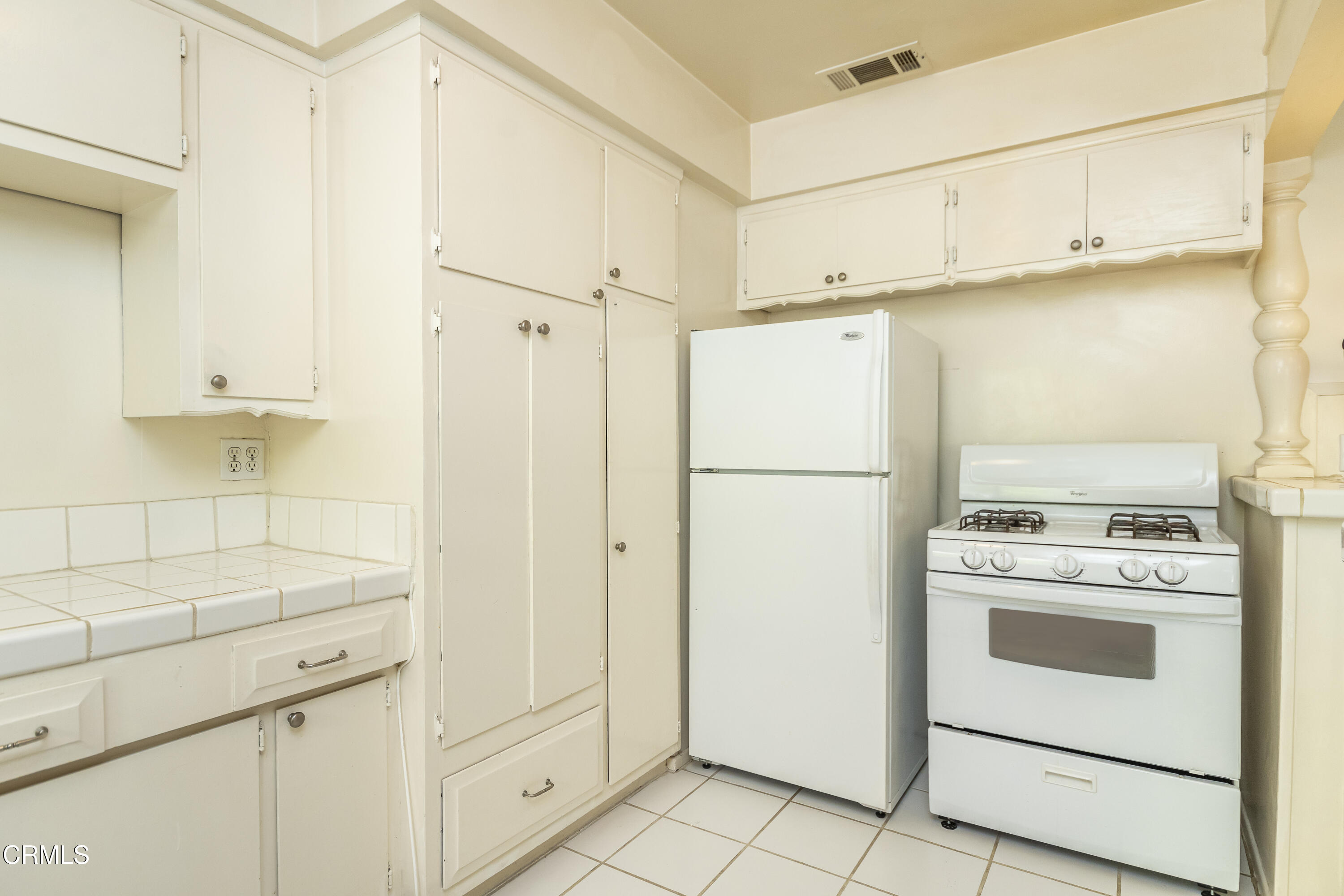 3021 Ashwin Drive, Unit B La Crescenta, CA 91214 - Photo 9 of 20 a kitchen with white cabinets and white appliances