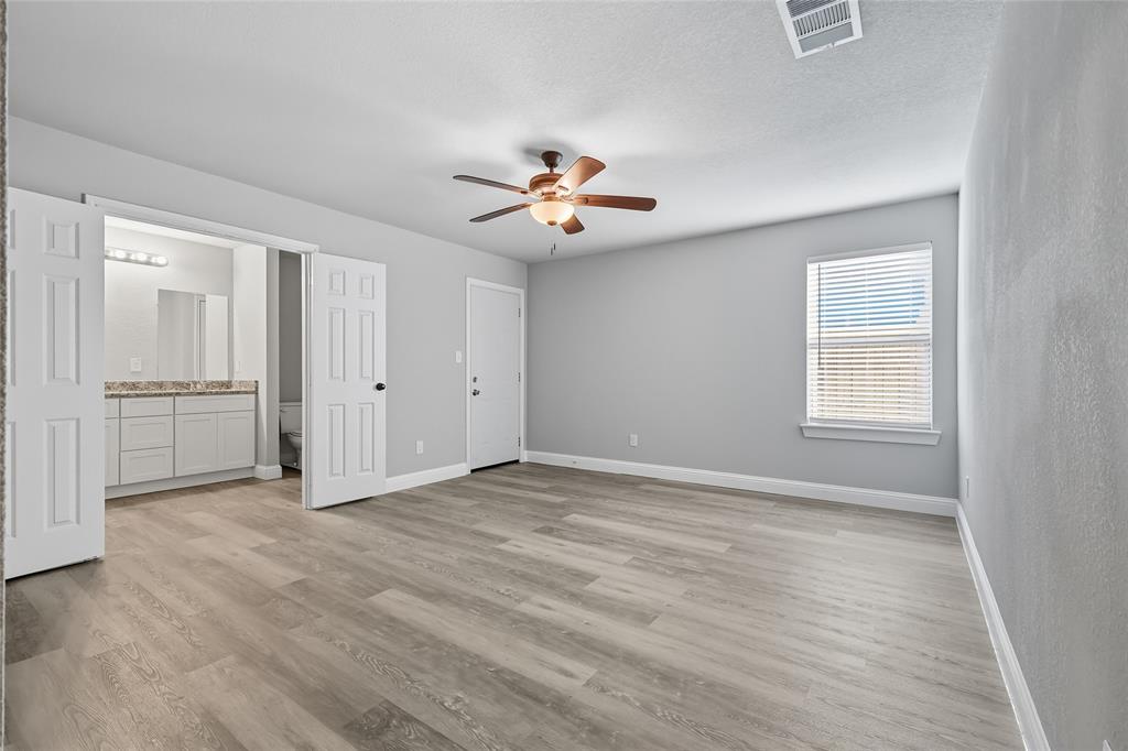 3151 Stag Road Dallas, TX 75241 - Photo 13 of 19 wooden floor in an empty room with a window