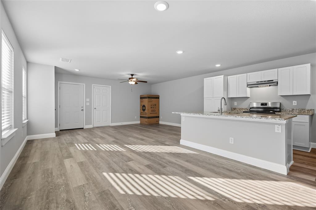 3151 Stag Road Dallas, TX 75241 - Photo 3 of 19 a view of a kitchen with microwave and cabinets