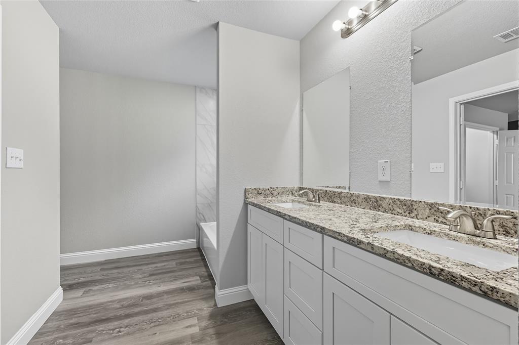 3151 Stag Road Dallas, TX 75241 - Photo 10 of 19 a bathroom with a sink and a mirror