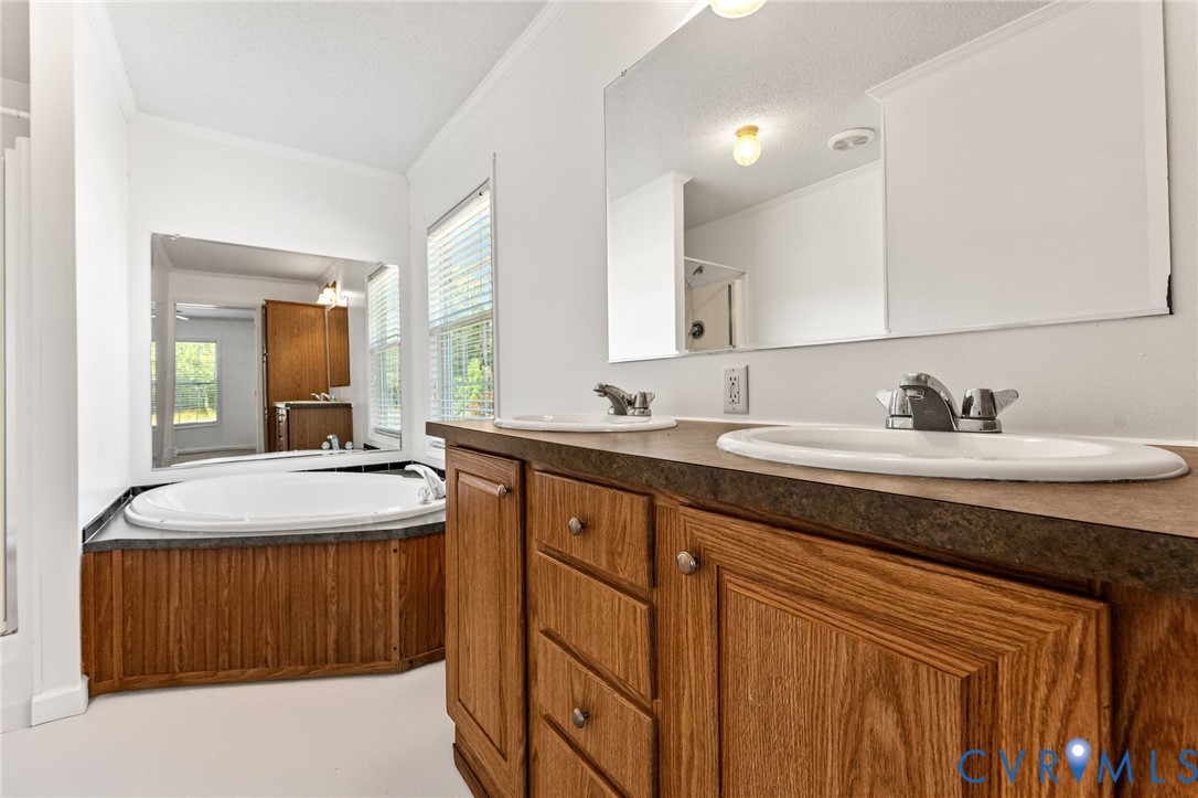 1450 Mt Prospect Road Laneview, VA 22504 - Photo 12 of 25 Dual vanity sinks, soaking tub & walk-in shower.
