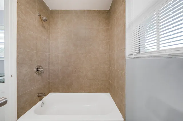 a bathroom with a shower and a toilet