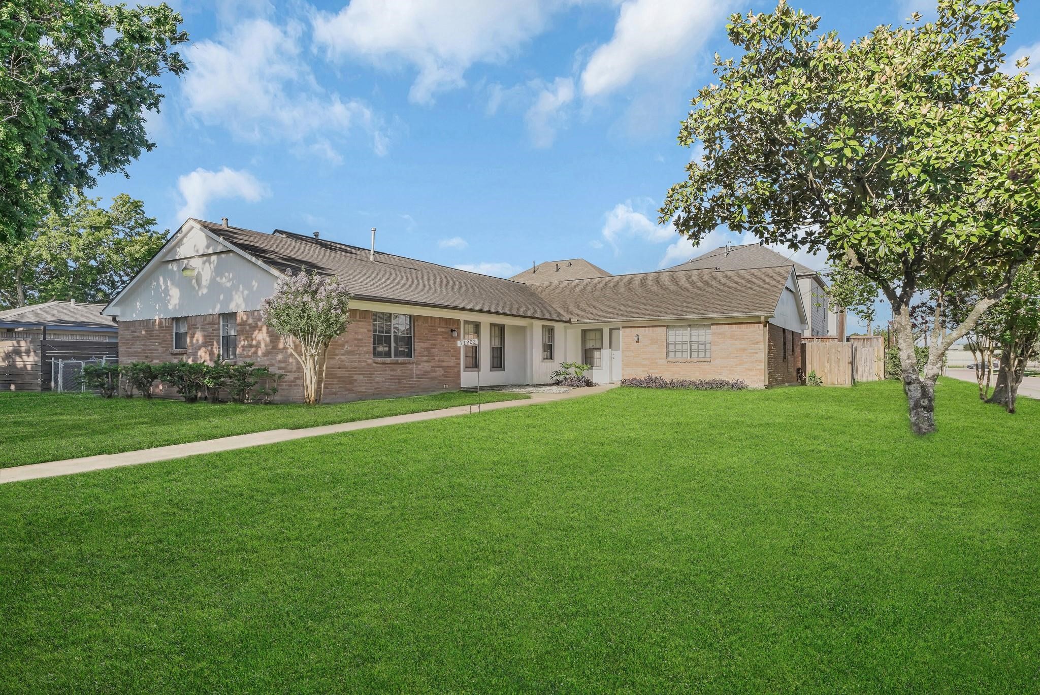 11202 Waxwing Street Houston, TX 77035 - Photo 17 of 19 a view of a house with a big yard