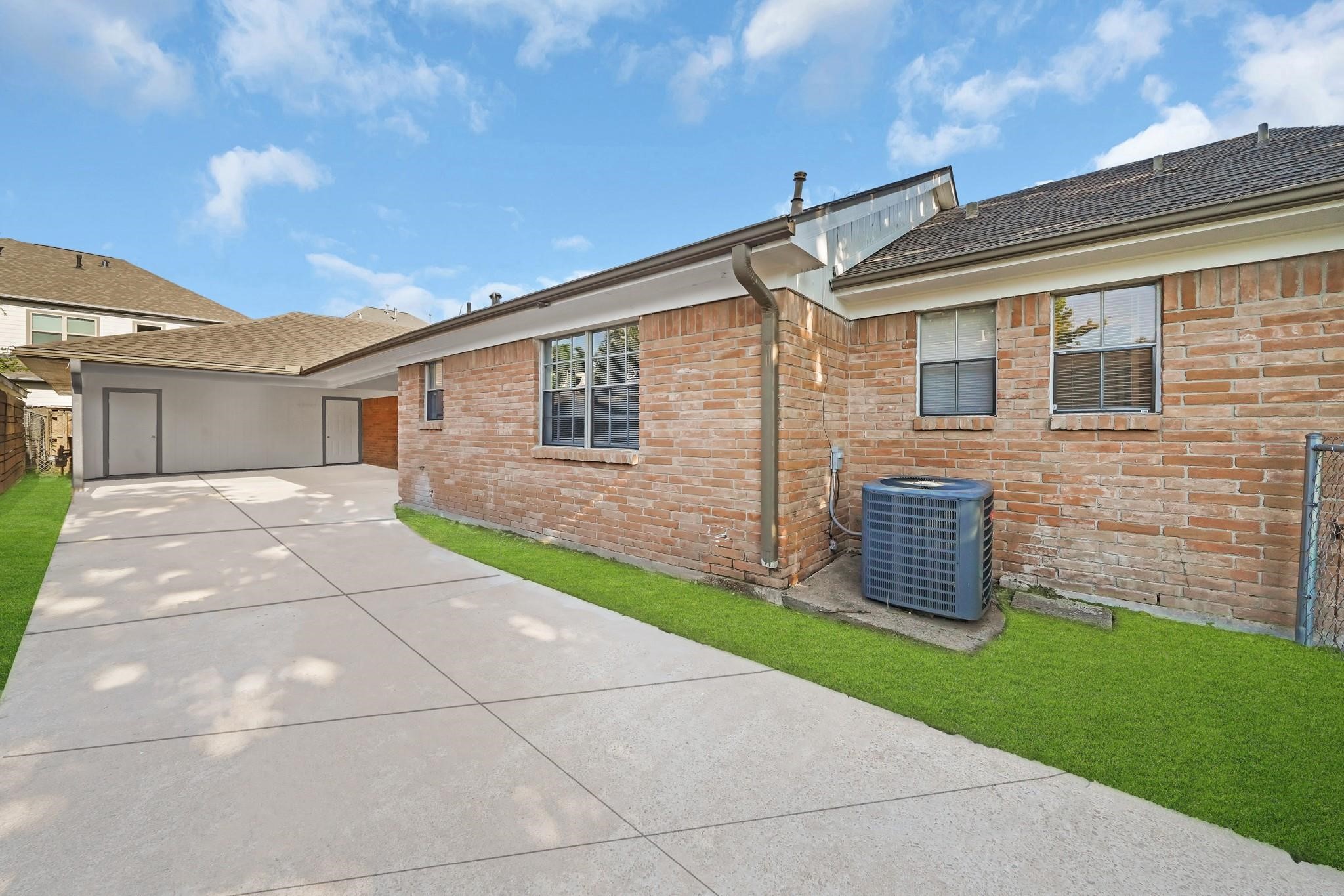 11202 Waxwing Street Houston, TX 77035 - Photo 18 of 19 a backyard of a house with table and chairs